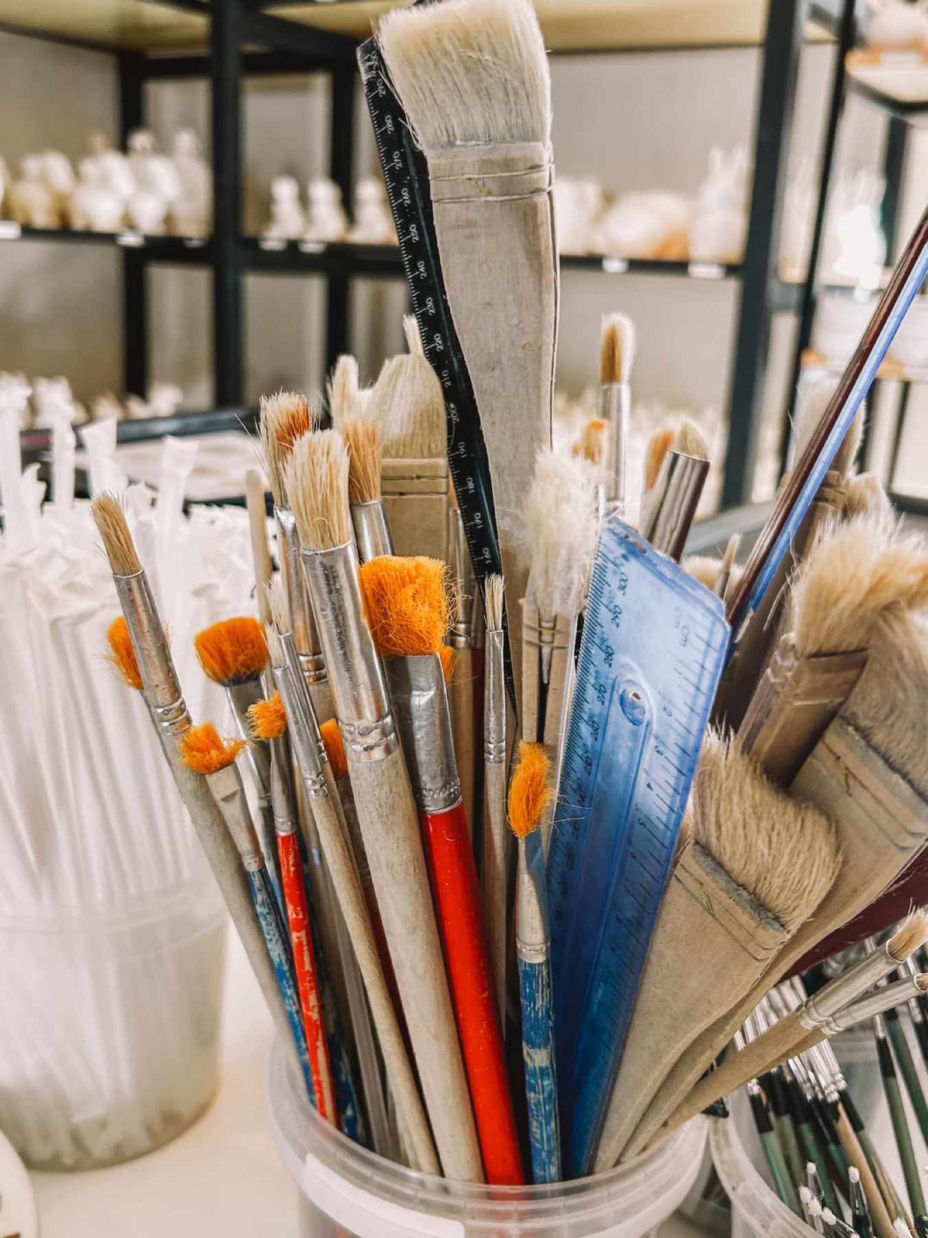 A colourful collection of pottery brushes
