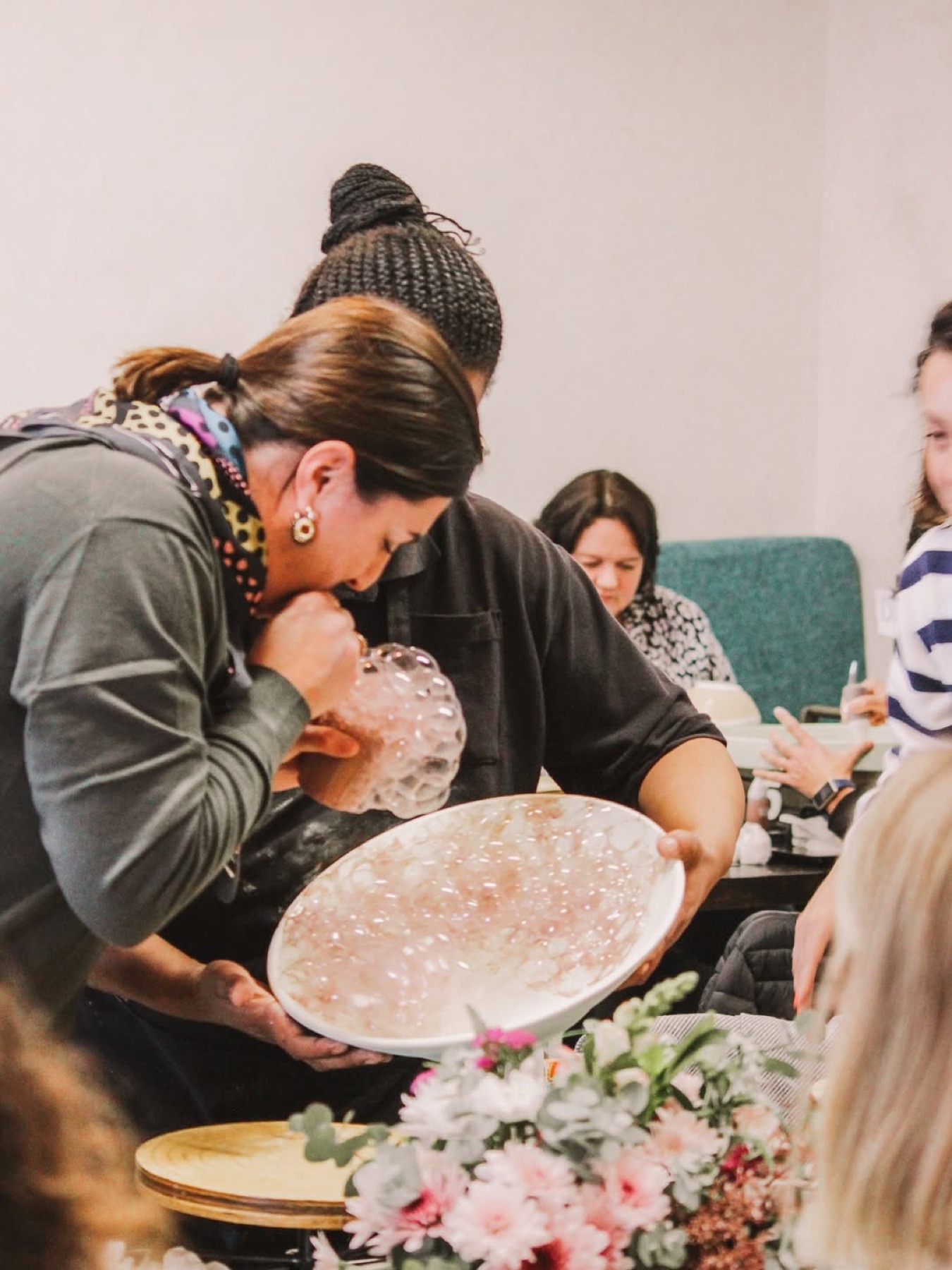 Guests revealing a newly painted serving bowl